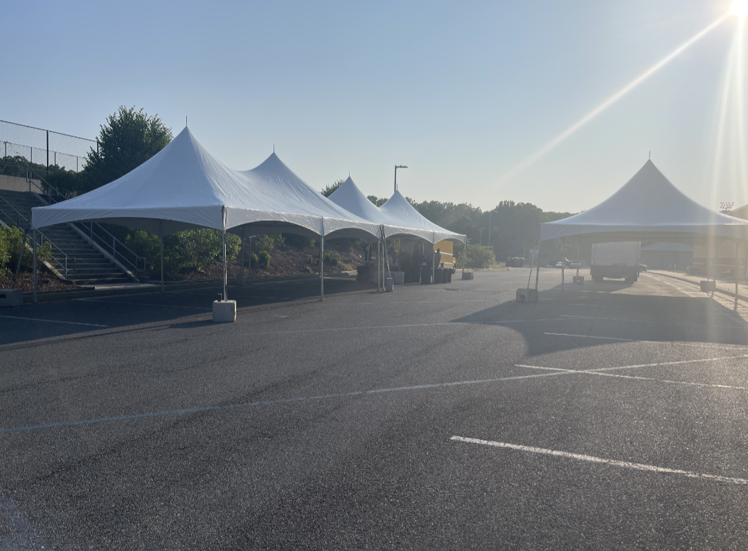 Multiple tent setup for a community event at Manchester Valley High School in Maryland